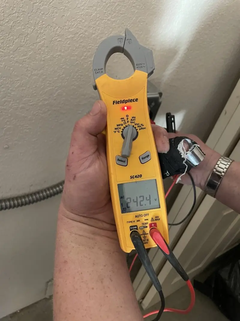 Voltage testing with clamp meter during Ceiling Fan Installation in Ellsworth
